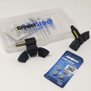 Figure 9. Laser alignment kit (Grower Select model HS783) including a laser assembly (left), number 392 batteries, and a target assembly (right). Each assembly fits into the v-groove of each pulley.