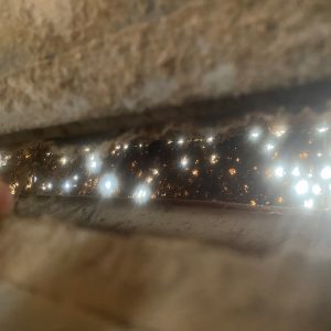 Figure 4: This photo of a blocked vent was taken from inside the house looking through the sidewall vent.