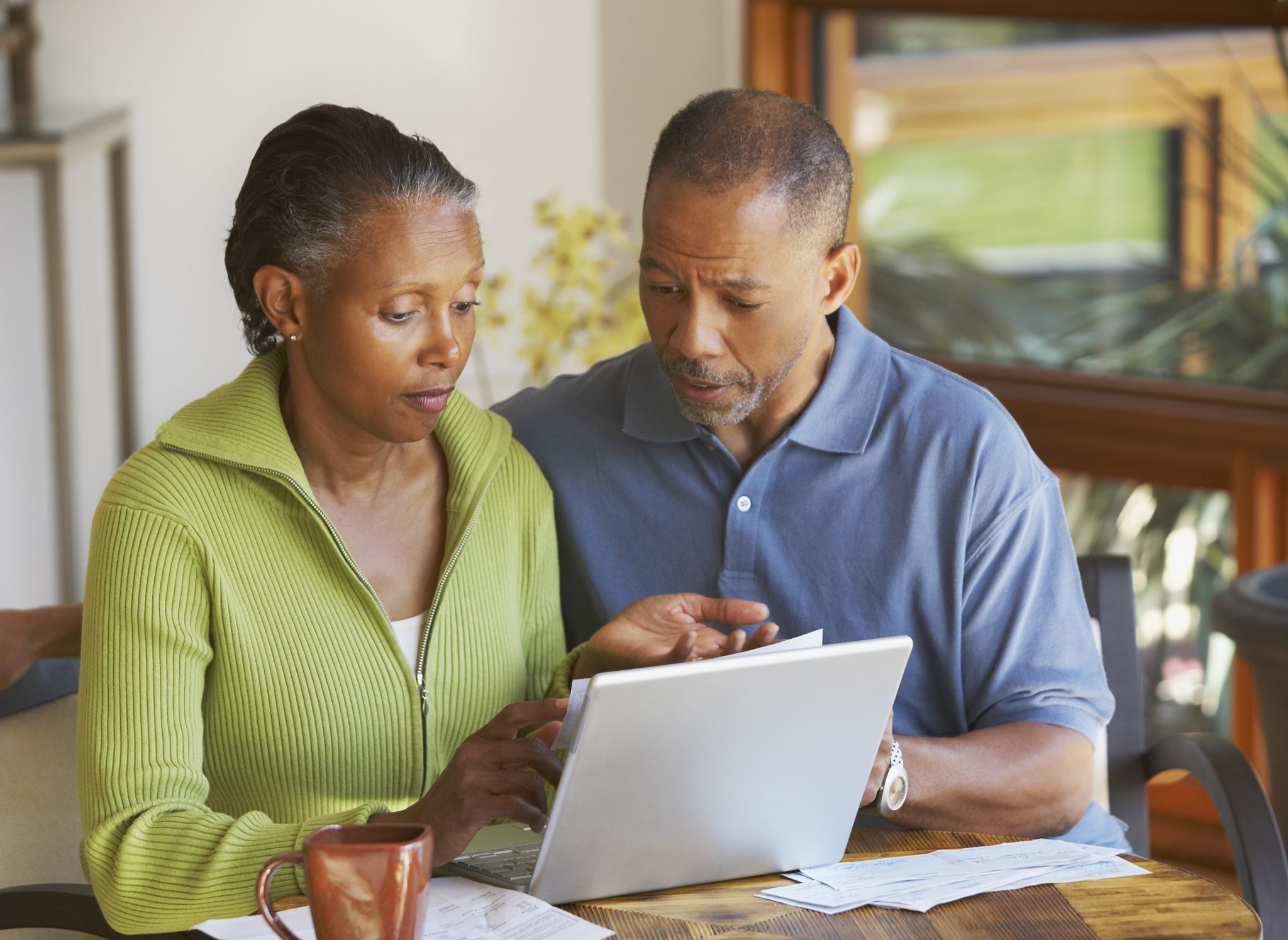 Older black couple at a computer