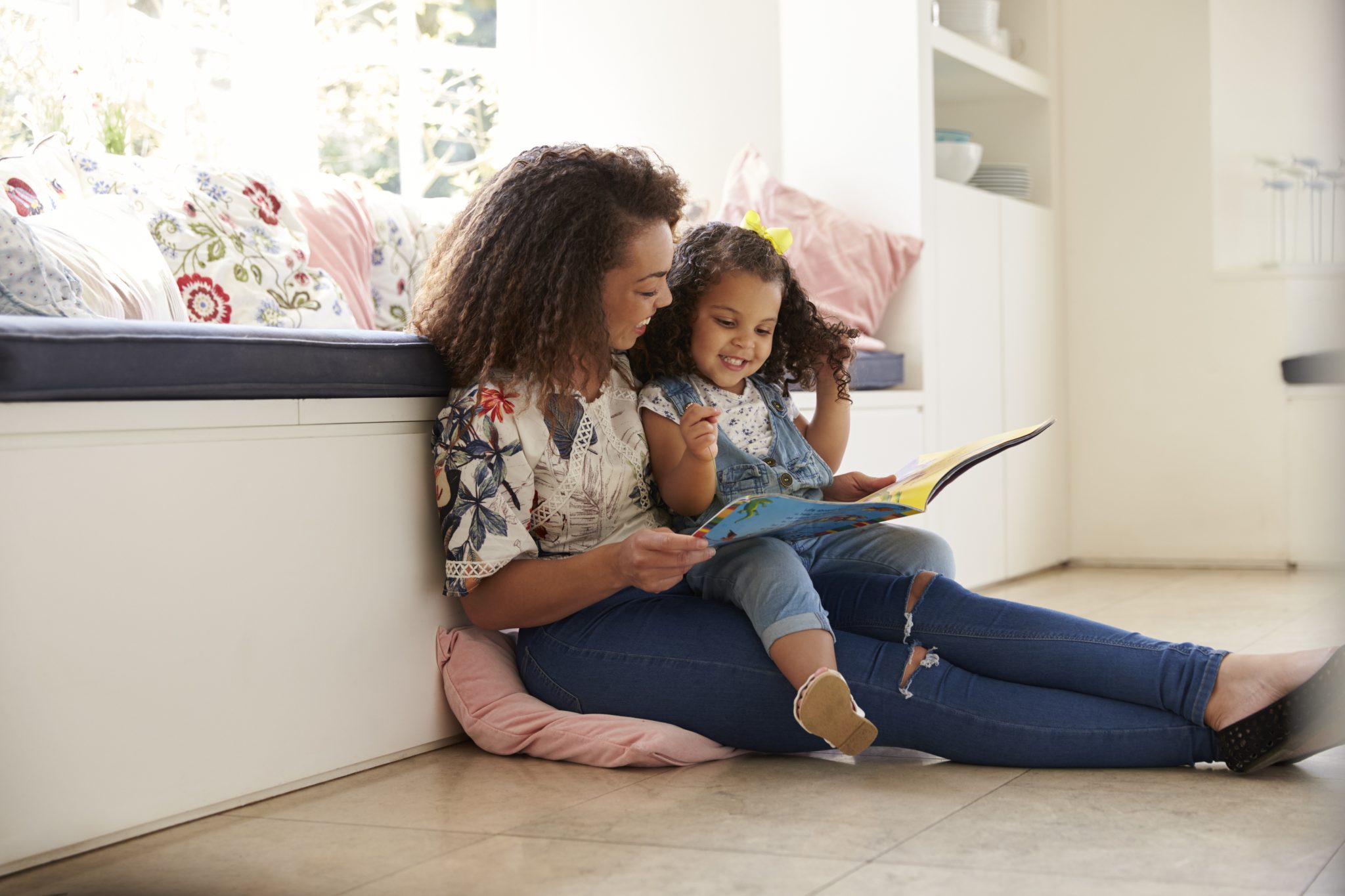 A mother and child reading a book