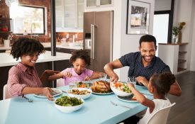 African-American family eating dinner