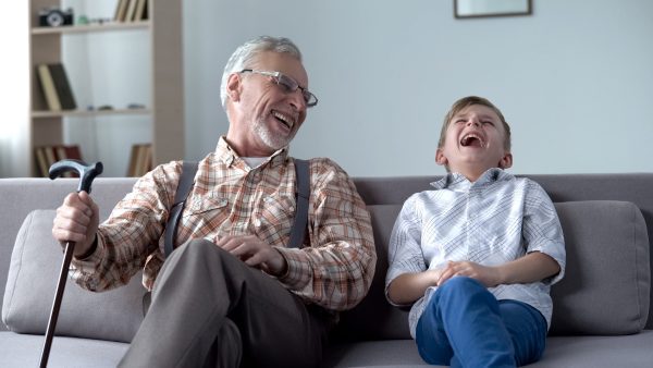 Old man and young boy laughing together
