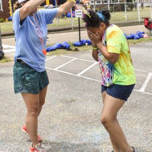 eyes closed while getting color at The Abbeville Color Run