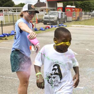 Michelle Puckett and child at the Abbeville Color Run
