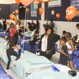 orange balloons, several beds in gym