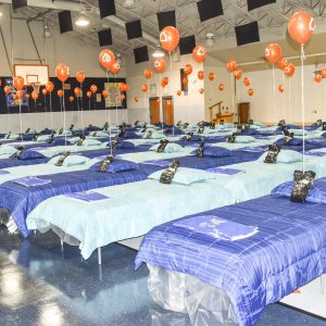 orange balloons, several beds in gym