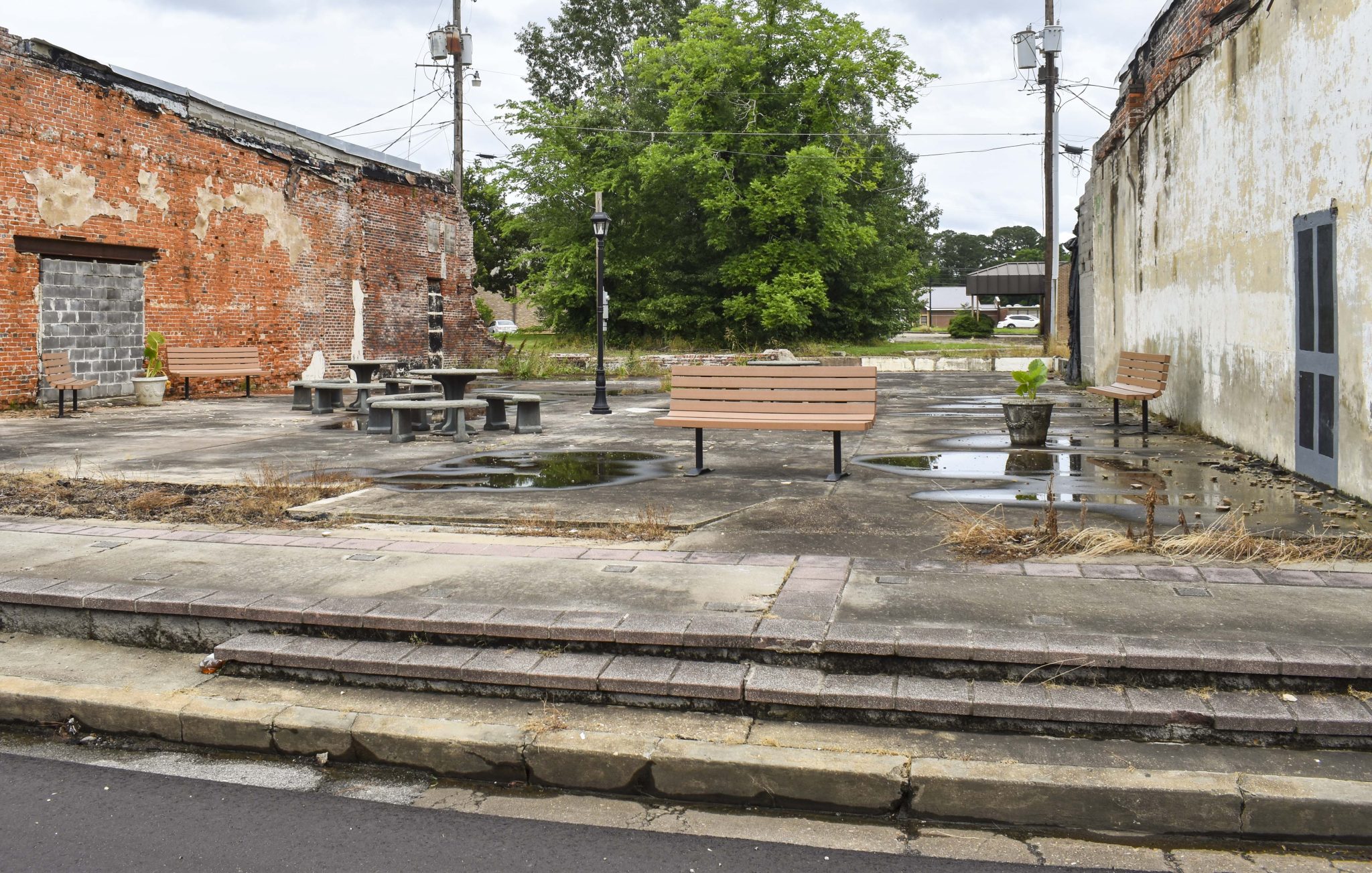 Several benches on pavement in Linden, Alabama