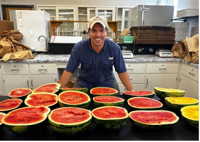 Figure 8. Andre da Silva evaluates vegetable cultivars adaptable to Alabama growing conditions.