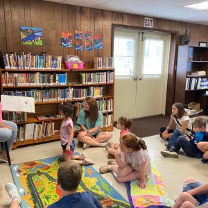 reading books about growing seeds at the Billingsley Library