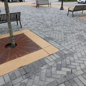 Permeable pavers are set in sand, gravel, a raised-grid structure, or a combination of these.