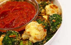 Tree Dunkers, broccoli and cauliflower around red sauce in clear bowl
