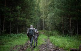 A father and son walking a hunting trail together