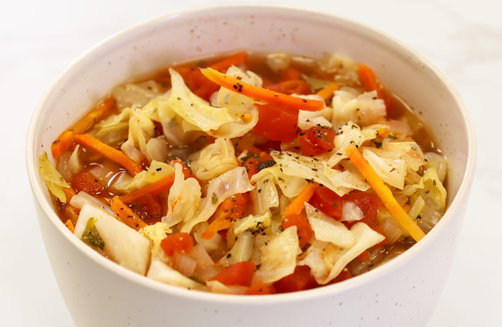 Classic Cabbage Soup in white bowl