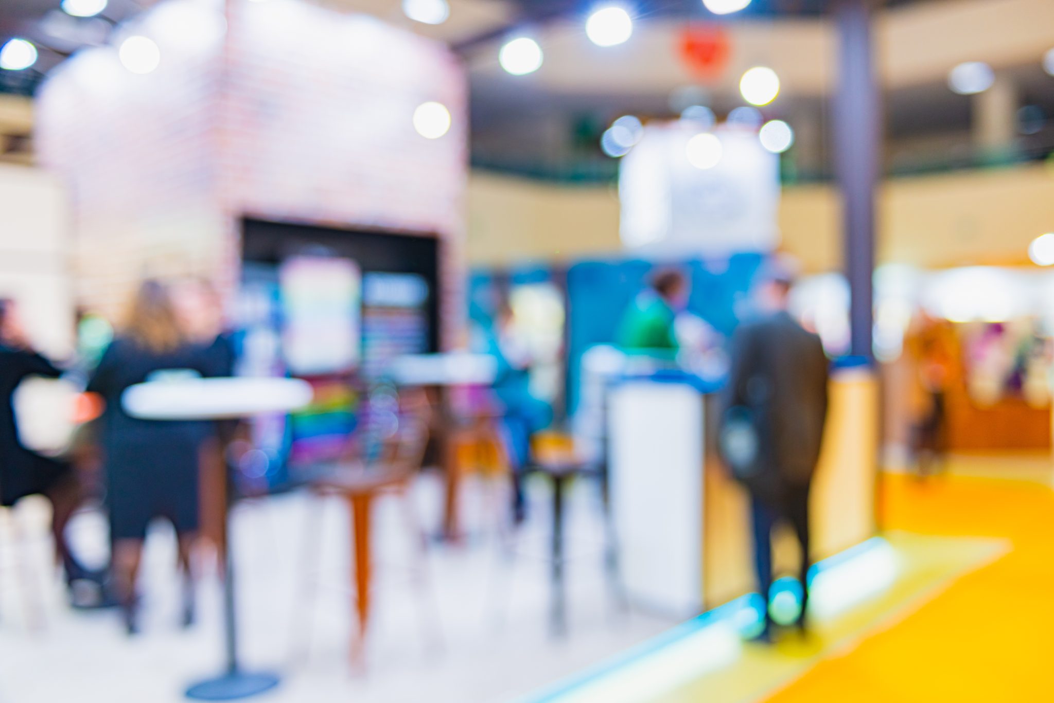 A blurry image of a booth at a trade show.