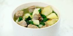 Get Your Greens Soup, kale, sausage, and potatoes in white bowl