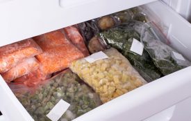 A freezer full of frozen foods with labels