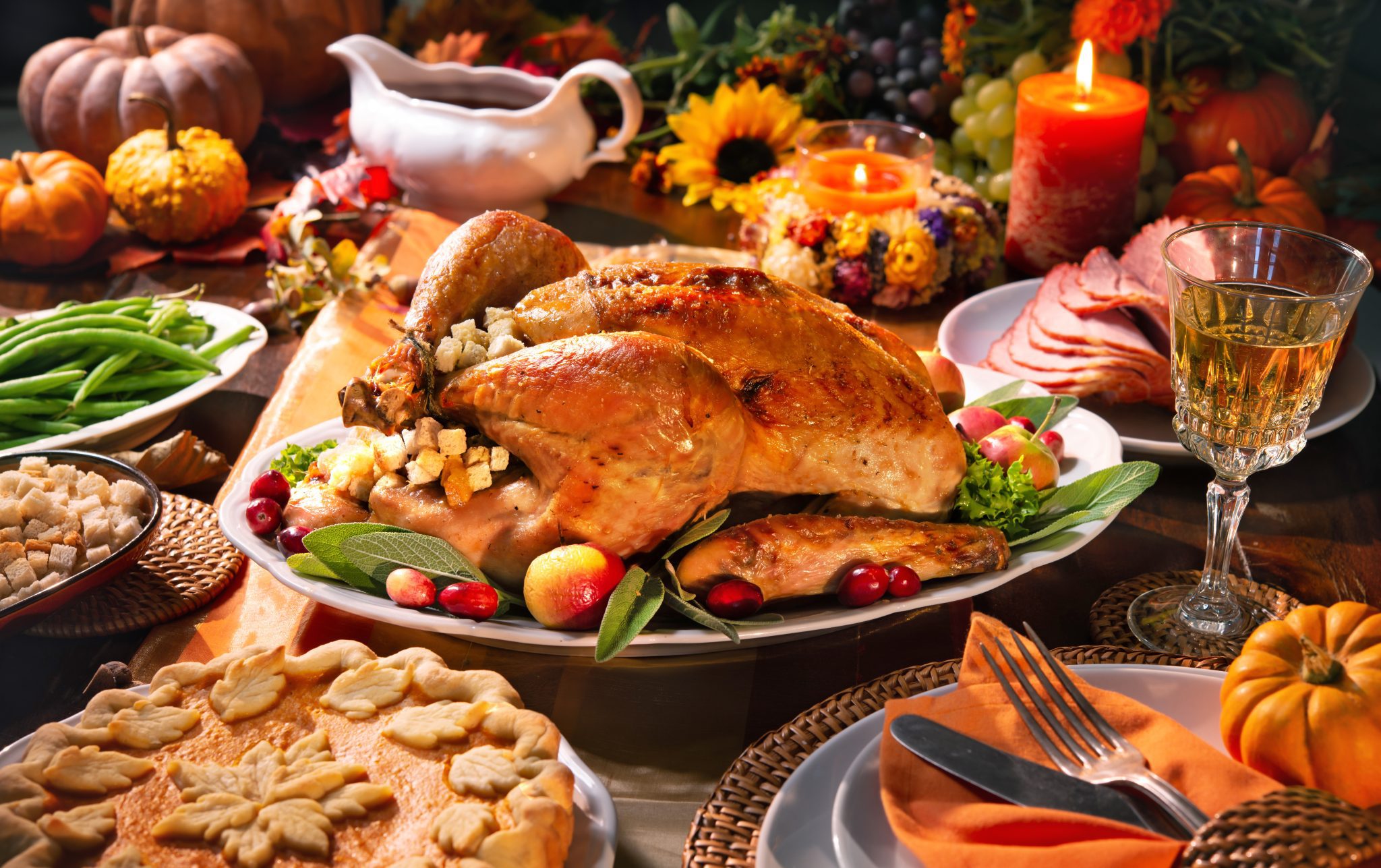 A Thanksgiving turkey spread on a table with fixings.