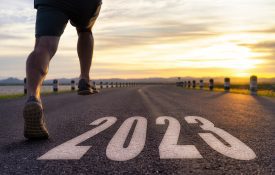 man running on road that says 2023