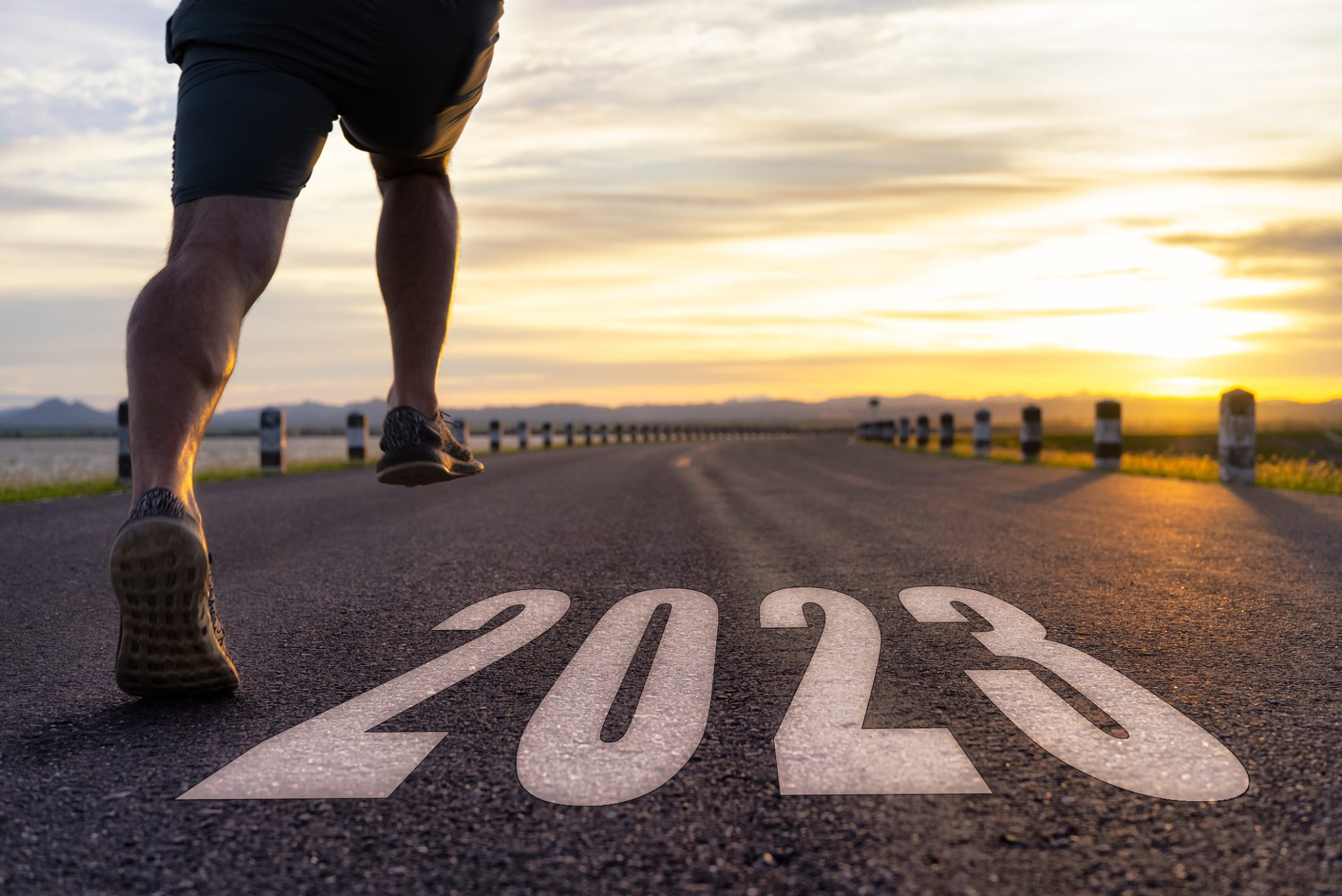 man running on road that says 2023