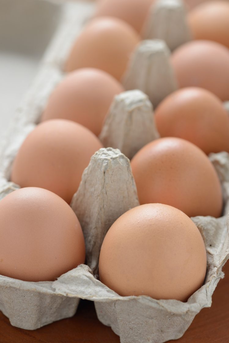 Brown eggs arranged in a carton