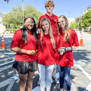 a group of students in red shirts