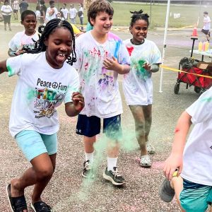 A group of children running at the Color Run at Abbeville Elementary