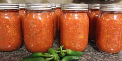 Jars of homemade salsa with peppers
