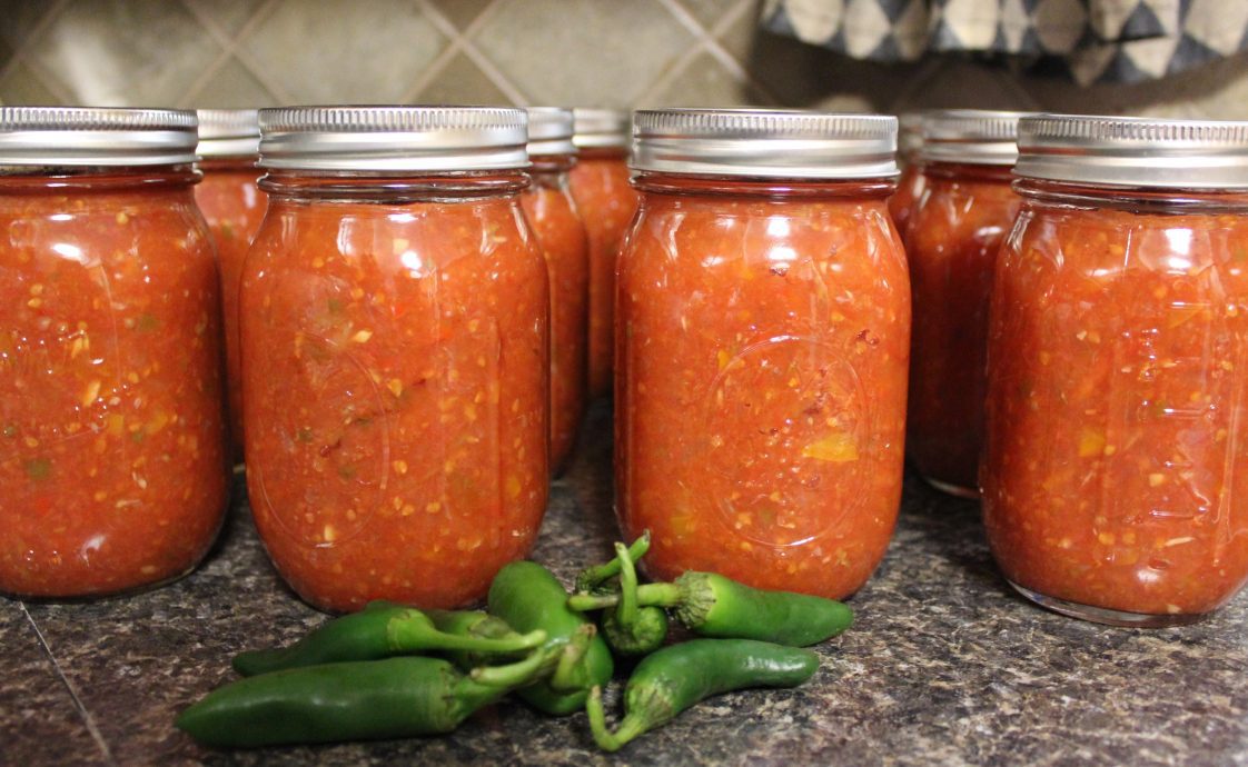 Jars of homemade salsa with peppers