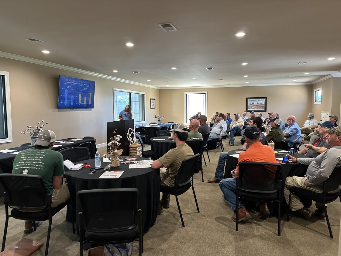 Figure 2. Scott Graham and Caitlyn Lawton present insect control updates to local row crop growers at an Alabama Extension event.
