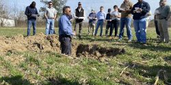 Figure 11. Rishi Prasad speaks to Alabama row crop growers at a field day presentation.
