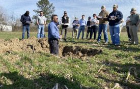 Figure 11. Rishi Prasad speaks to Alabama row crop growers at a field day presentation.