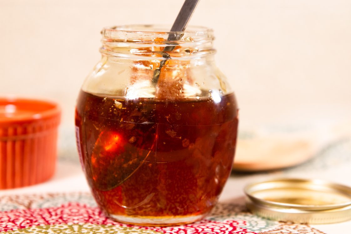 honey in a jar with a spoon