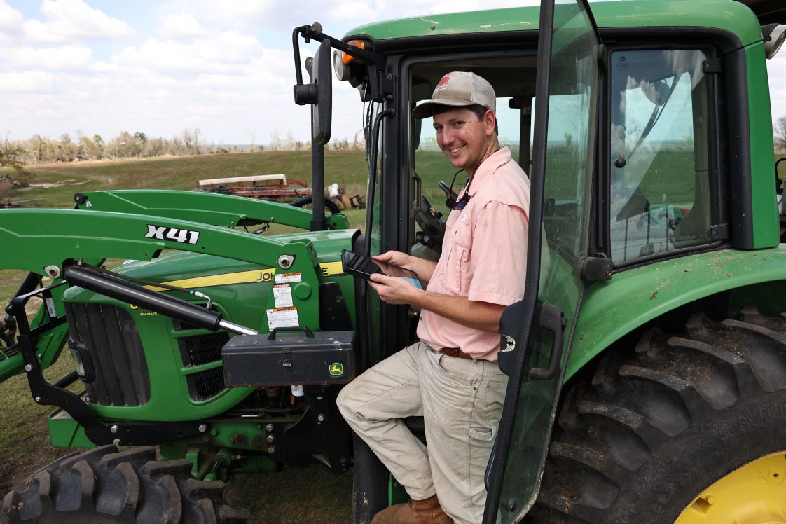 Garrett Dixon poses on a tractor