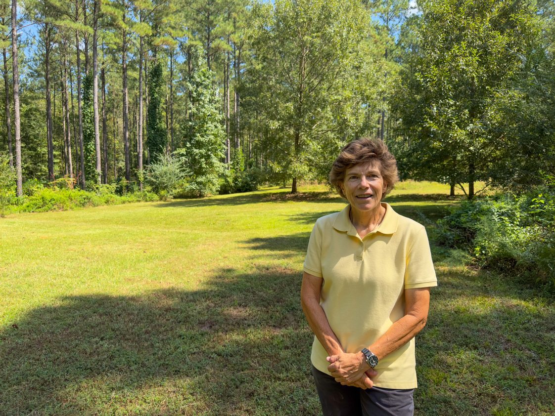 ForestHER Program participant Jackie Meggison poses in her private forest in Pike County, Alabama.