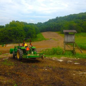 Figure 1. Two tractors are better than one. Cooperatives can help share the workload and pool resources like equipment and time to efficiently improve and maintain habitat.