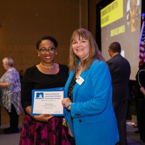 Portia Johnson receiving the Communications Written Media Award.