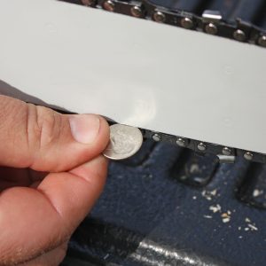 Figure 12. The chain should be tensioned to a dime’s width.