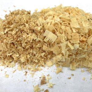 Figure 11. Fine sawdust or increasingly smaller chips are signs of a dull chain, as seen on the left side of the photo.
