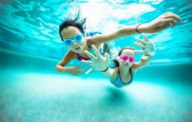 Two young girls underwater