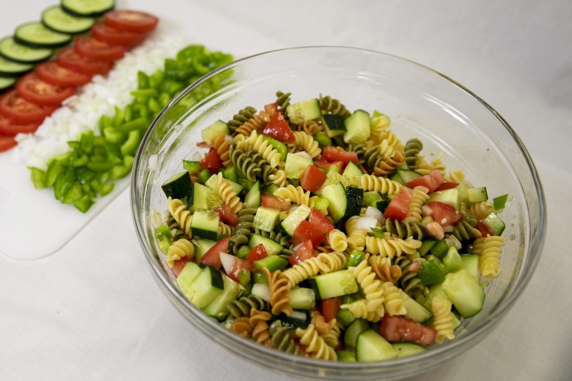 A bowl of pasta salad.