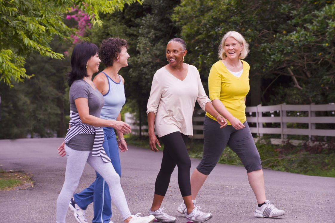 Older women walking together outdoors