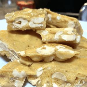 Peanut brittle broken into pieces.