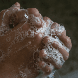 A closeup of someone washing their hands.