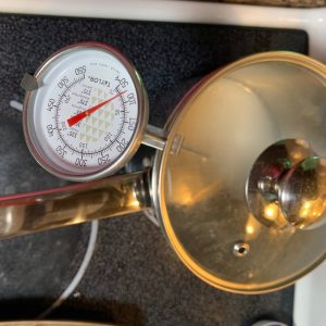 A pot with a candy thermometer.