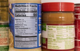 The nutrition labels on jars of pasta sauce and peanut butter.
