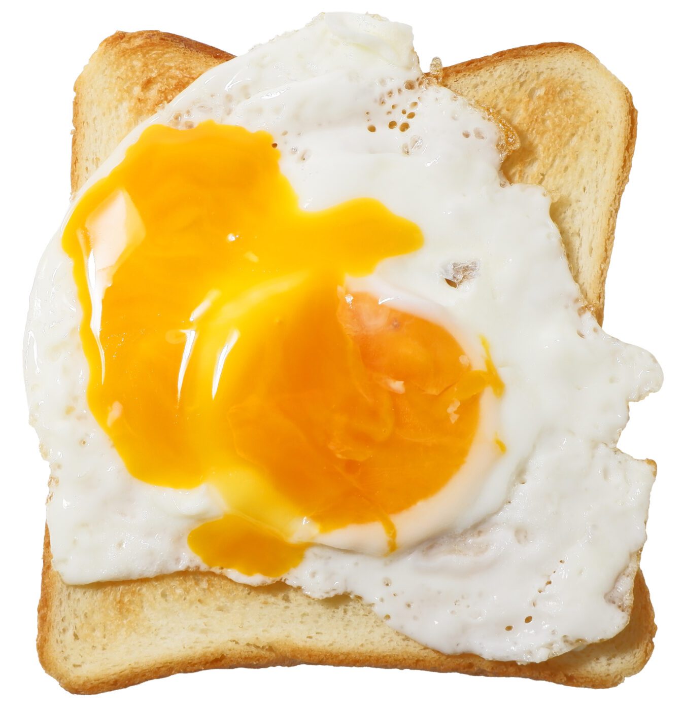 Broken egg yoke on a piece of toast.