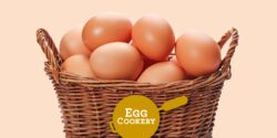 A basket of brown eggs on a tan background.