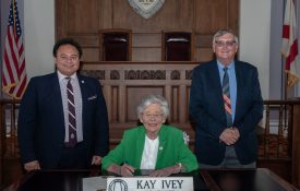 1890 Administrator Majed El-Dweik and Extension Director Mike Phillips pictured with Alabama Governor Kay Ivey at the proclamation signing for Extension Week.