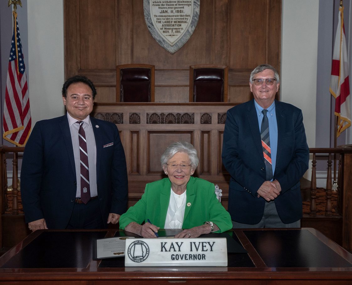 1890 Administrator Majed El-Dweik and Extension Director Mike Phillips pictured with Alabama Governor Kay Ivey at the proclamation signing for Extension Week.