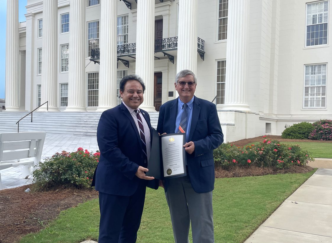 1890 Administrator Majed El-Dweik and Extension Director Mike Phillips pictured with Extension Week proclamation outside of the state capitol building.